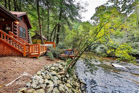 Sliding rock cabins - Creekside Serenity is a heavily wooded, deeply shaded, rustic, 1.88 acre property and is secluded. It is a 1 king bedroom, one bath cabin, one story pet friendly cabin (no pet fees) with fenced yard, screened porch, with firepit, propane log fireplace and wireless internet. This Sliding Rock Cabin is an ADULT ONLY cabin (no guests under age 25 ... 